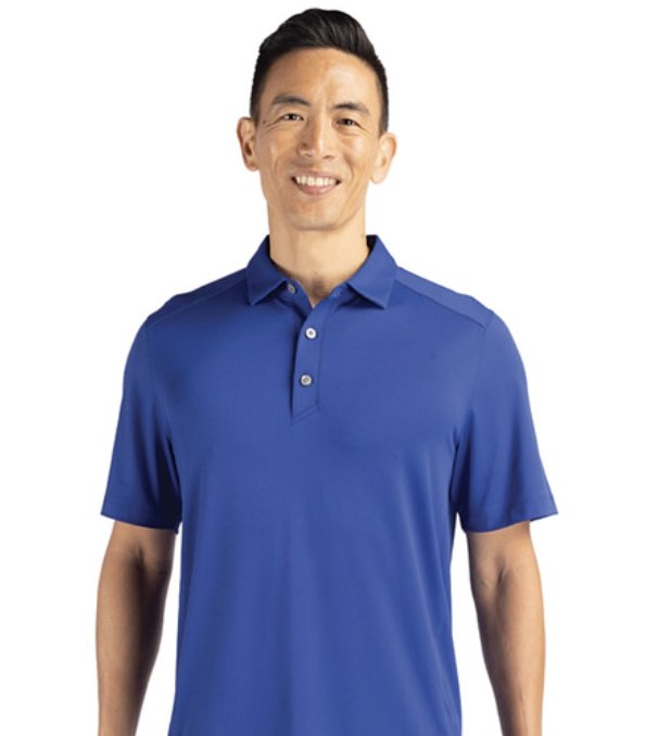Man wearing a royal blue Cutter and Buck performance polo